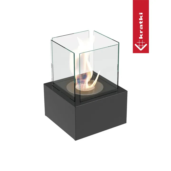 Kratki Tango2 TÜV tafelhaard met glazen ombouw en zwarte basis, brandende vlam zichtbaar.