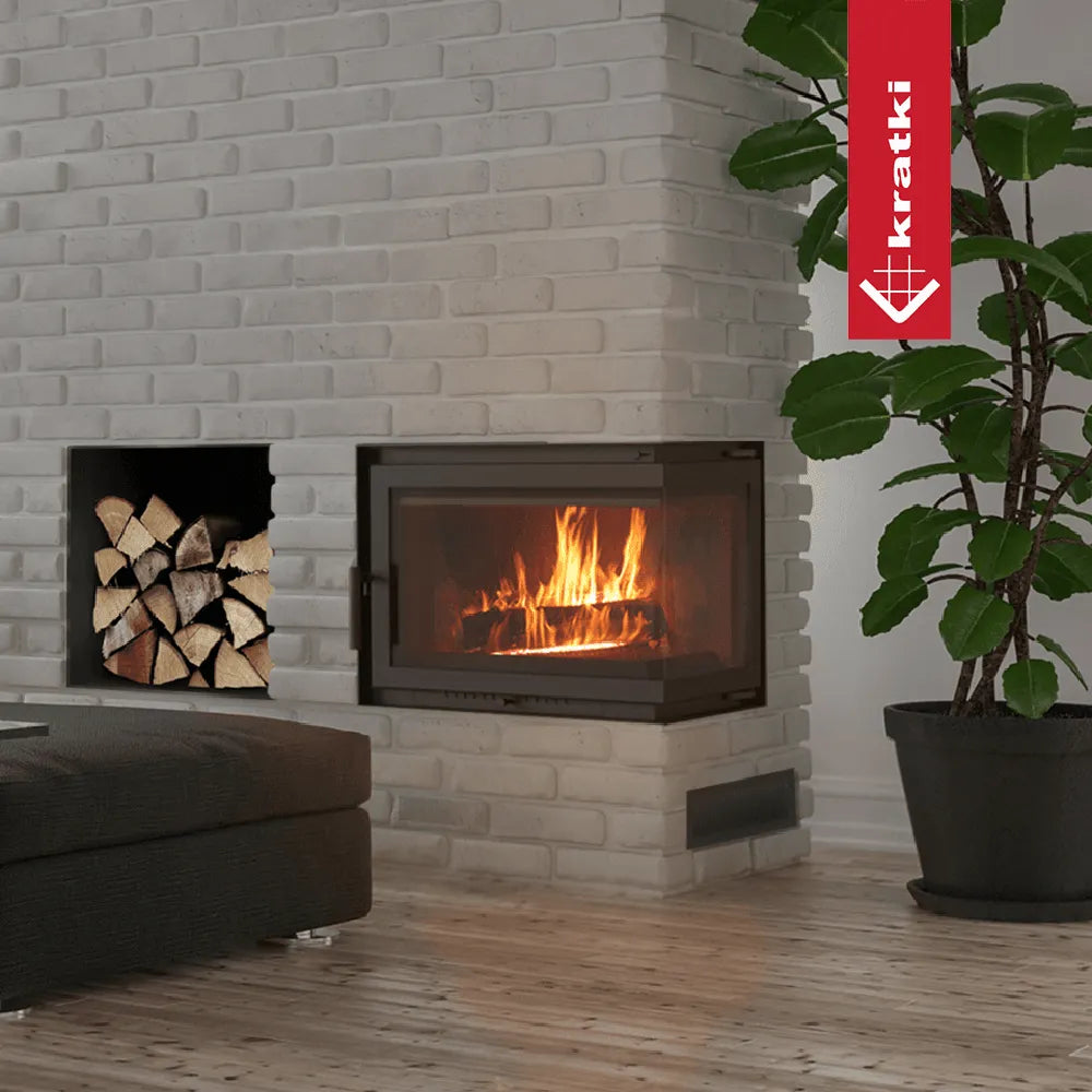 Kratki Simple M 10 kW Rechts haard in moderne woonkamer met witte bakstenen muur en plant.
