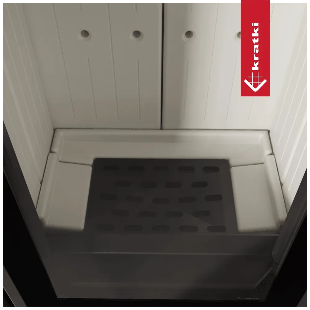 Binnenkant van de Kratki Enyo haard met wit interieur en zwart rooster.