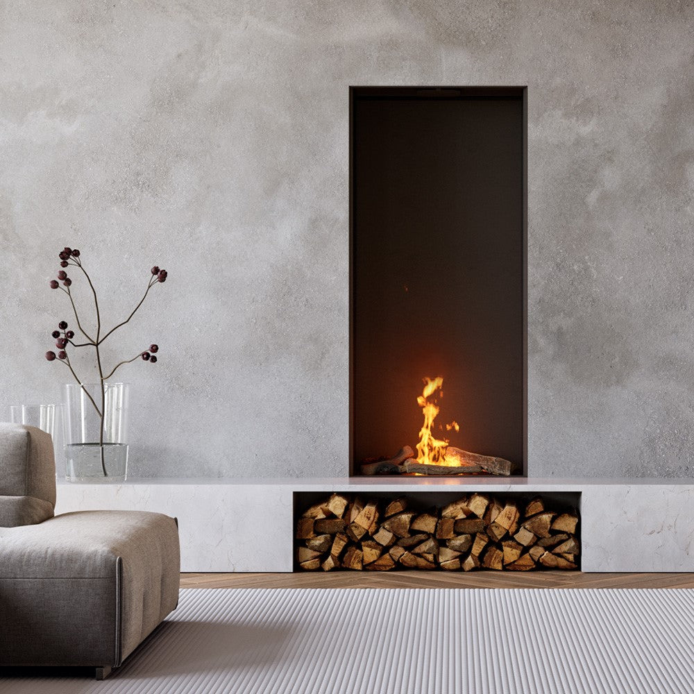 Element4 Sky Large Front Bio haard in een moderne woonkamer met houtopslag en decoratieve takken.