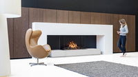 Faber Matrix 1050/650 III Driezijdig in moderne woonkamer met brandend haardvuur