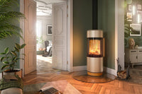 Spartherm Passo XS Style in groene woonkamer met brandend vuur