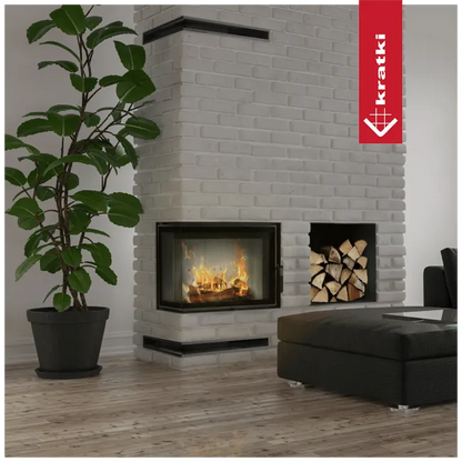 Kratki Lucy 12 kW Slim Links haard in moderne woonkamer met witte bakstenen muur en plant.