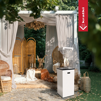Kratki Patio Light terrasvuurtafel met vlammen in tuinpaviljoen
