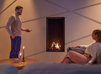 Trimline Fires 55XH Front in een woonkamer met brandende haard