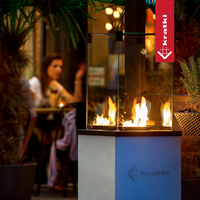 Kratki Patio Mini terrasverwarming met zichtbare vlammen in een sfeervolle ruimte