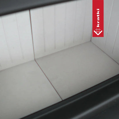 Binnenkant van de Kratki Nadia 14 kW houtkachel met witte bekleding.