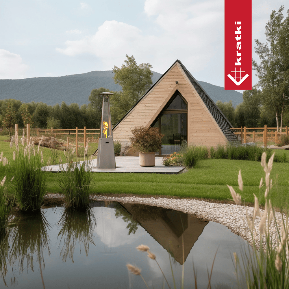 Kratki Umbrella terrasheater naast houten A-frame woning in tuin