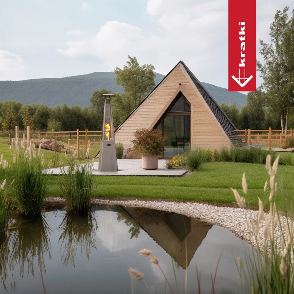 Kratki Umbrella terrasverwarmer naast houten A-frame huis