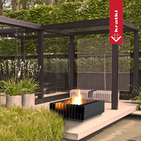 Kratki Erizo vuurtafel op terras in moderne tuin