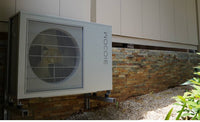 Biodom BioBlock 9M buitenunit aan gevel, met ventilator en rooster