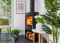 Charlton & Jenrick Woodtec FCS Cylinder houtkachel in lichte woonkamer
