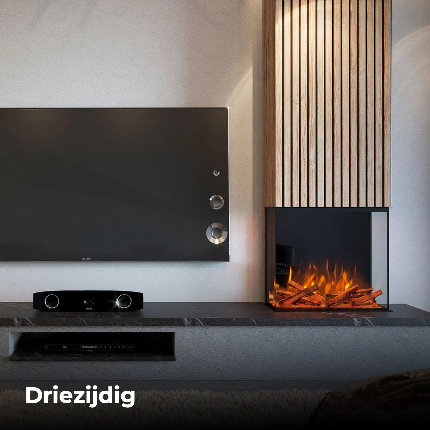 Fair Fires Tru Vizion Pano 700 driezijdige haard naast een moderne televisie en luidspreker.