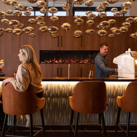 Trimline Fires 180E Solus ingebouwd in houten wand in luxe bar